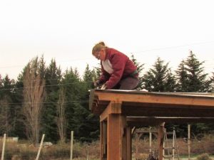 Jen McAllister working on the roof of the learning garden