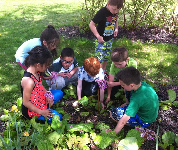 In the garden, children engage with all their senses, making learning concrete and memorable